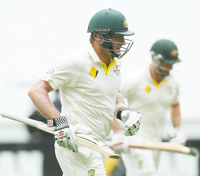 Ryan Harris leaves the field as rain delays play 