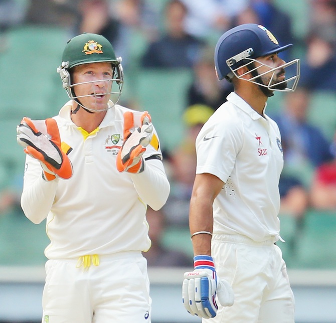 Brad Haddin has a few things to say to Virat Kohli. Photograph: Scott Barbour/Getty Images