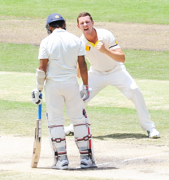 Josh Hazelwood of Australia celebrates the wicket of Murali Vijay of India