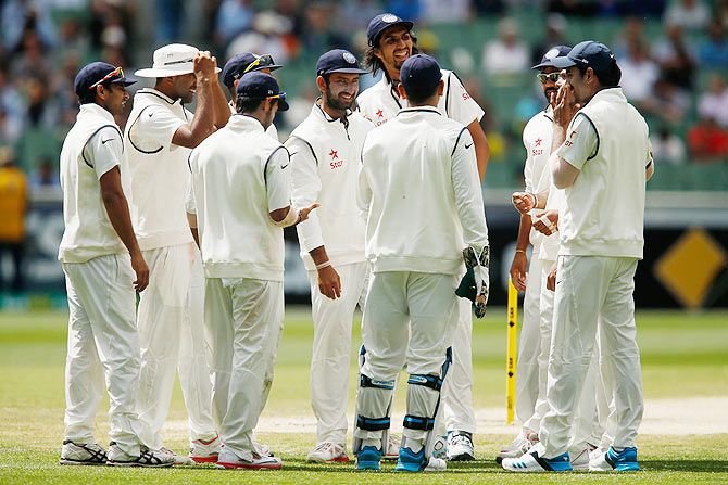 Indian players celebrate the wicket of Steve Smith of Australia on Monday