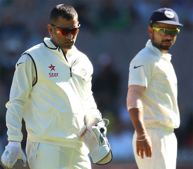 MS Dhoni and Virat Kohli of India during day one of the Third Test against Australia at Melbourne Cricket Ground