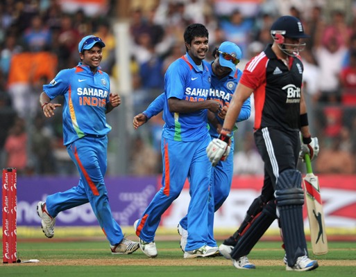 Varun Aaron celebrates a wicket.