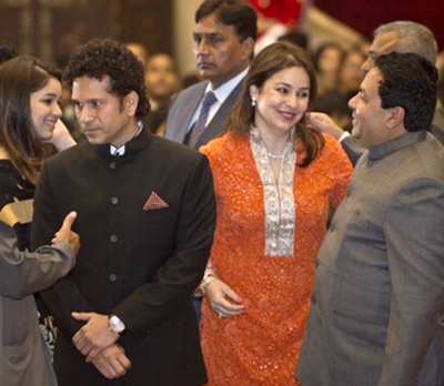 Sachin Tendulkar with his wife Anjali (right) and daughter Sara (background) during the investiture ceremony on Tuesday