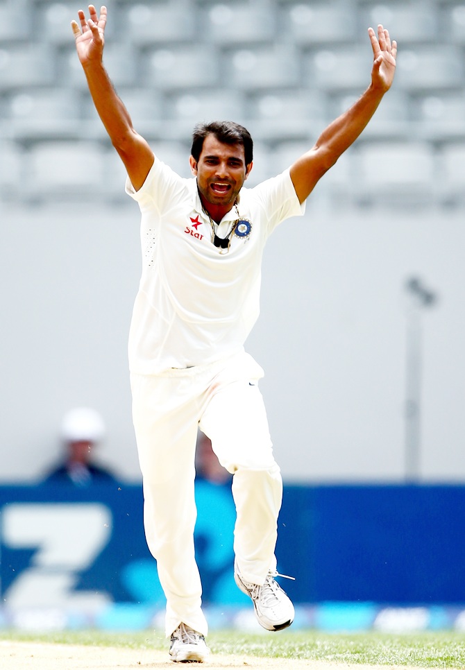 Mohammed Shami of India celebrates the wicket of Hamish Rutherford