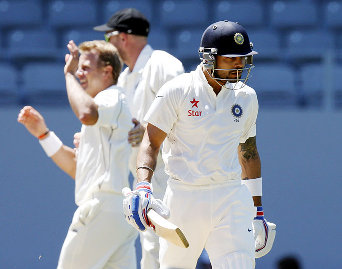 New Zealand's Neil Wagner (left) celebrates after dismissing India's Virat Kohli