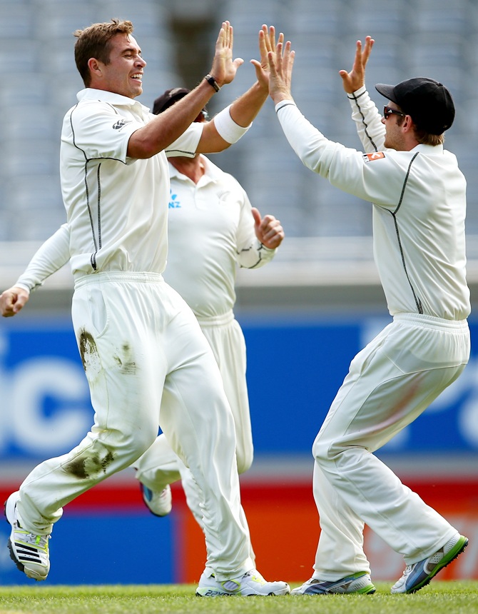 http://im.rediff.com/cricket/2014/feb/12kiwi1.jpg Tim Southee (left) celebrates a wicket