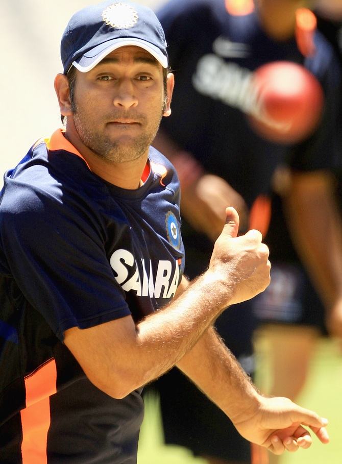 MS Dhoni bowls in the nets during a nets session