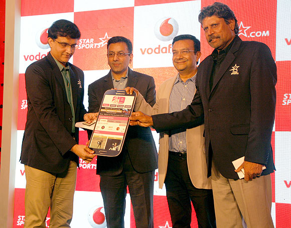 Former India cricket captains Sourav Ganguly and Kapil Dev at the Vodafone-Star India tie-up in Mumbai on Thursday
