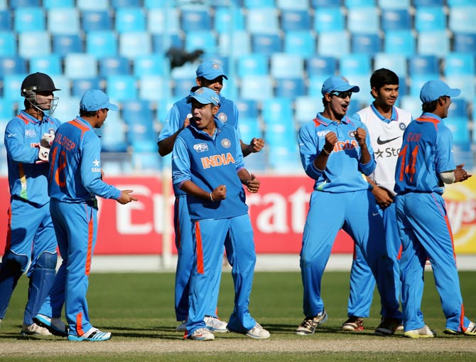 The Indian players celebrate the wicket of Pakistan's Kamran Ghulam during the ICC Under-19 World Cup Group A match
