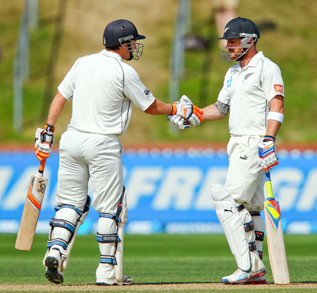 New Zealand's BJ Watling (left) and Brendon McCullum shake hands after breaking the world record for the sixth wicket partnership during Day 4