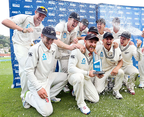 Man of the match Brendon McCullum celebrates the series triumph with teammates on Day 5 of the second Test against India in Wellington