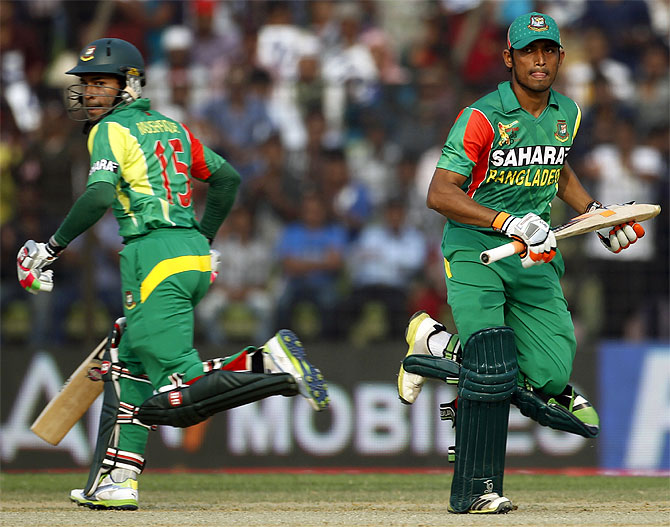 Bangladesh's Anamul Haque and captain Mushfiqur Rahim (left) run between the wickets