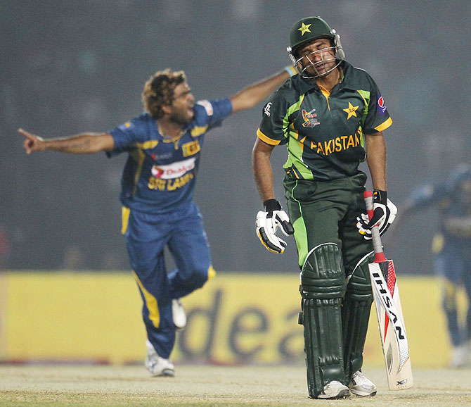 Pakistan's Bilawal Bhatti reacts as Sri Lanka's Lasith Malinga (left) celebrates his dismissal on Tuesday