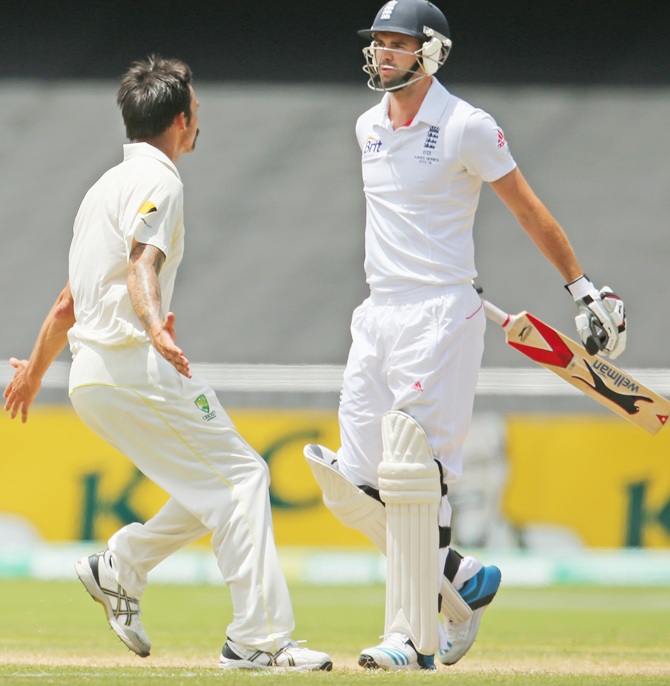 Mitchell Johnson of Australia celebrates after taking the wicket of James Anderson