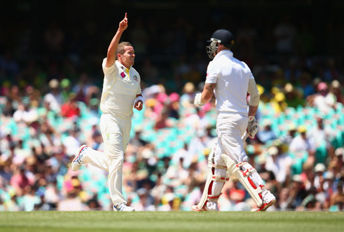 Peter Siddle of Australia celebrates after taking the wicket of Ben Stokes of England