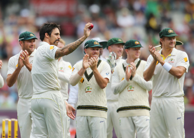 Mitchell Johnson acknowledges the cheer after a five-wicket haul