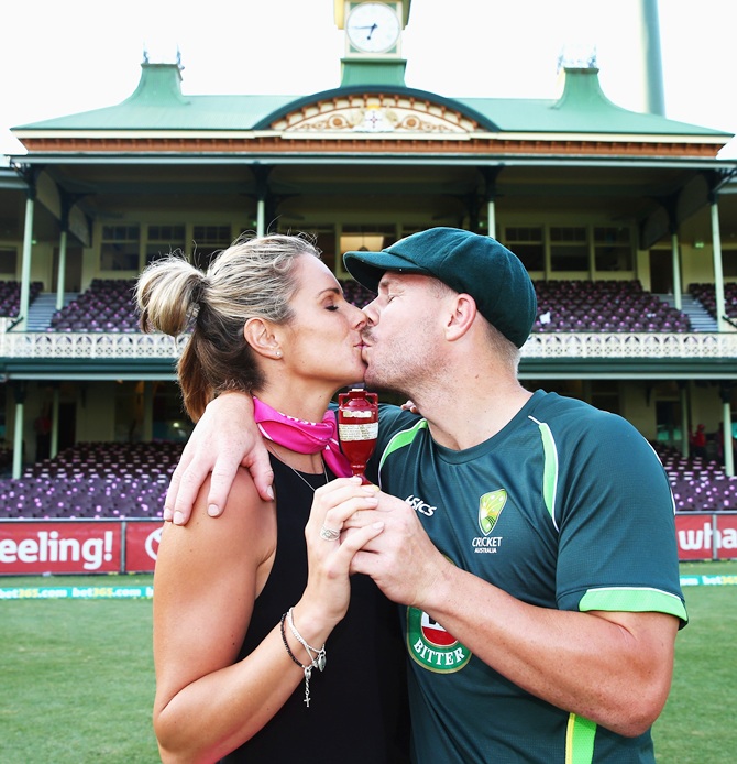David Warner of Australia and his partner Candice Falzon pose with the urn