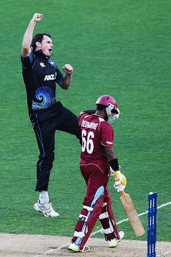 Kyle Mills of New Zealand celebrates the wicket of Narsingh Deonarine of the West Indies