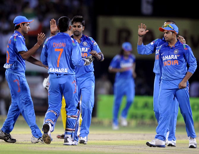 The Indian team celebrates a wicket
