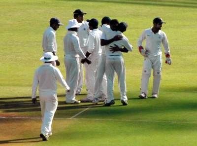 Maharashtra players celebrate the fall of a Mumbai wicket