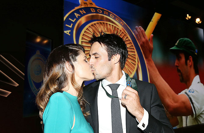 Mitchell Johnson is kissed by his wife Jessica Bratich-Johnson after winning the Allan Border Medal during the 2014 Allan Border Medal at Doltone House in Sydney on Monday