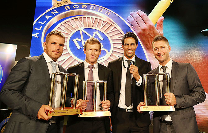 Aaron Finch, George Bailey, Mitchell Johnson and Michael Clarke pose with their awards during the 2014 Allan Border Medal night on Monday