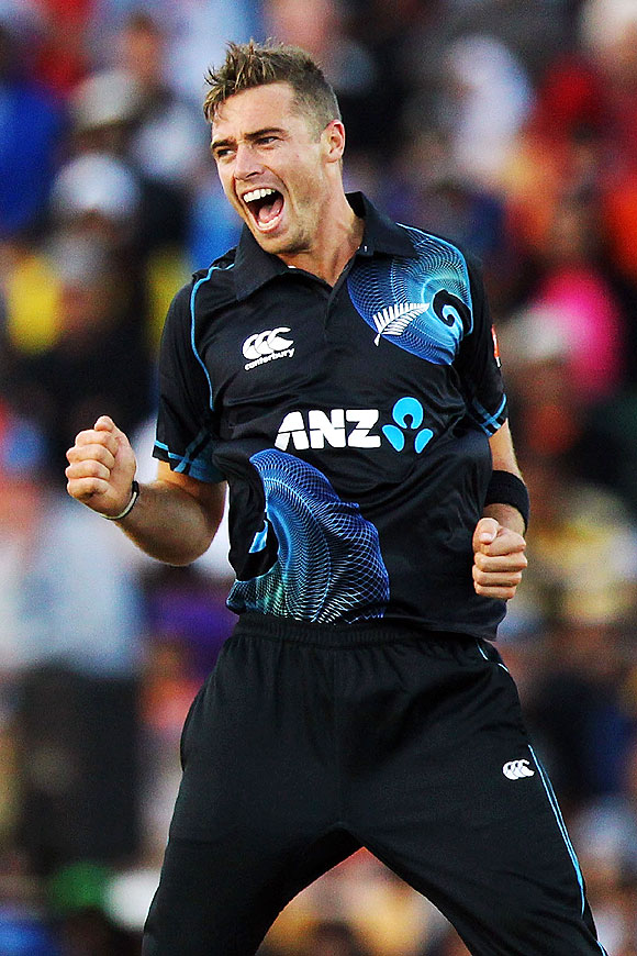 Tim Southee of New Zealand celebrates after taking the wicket of Rohit Sharma