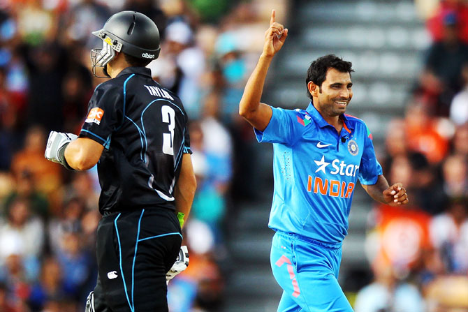 Mohammed Shami of India celebrates after taking the wicket of Ross Taylor of New Zealand