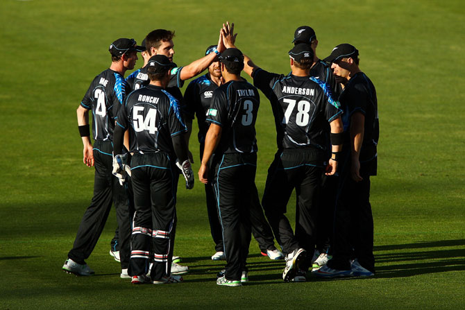 Zealand team celebrates a wicket