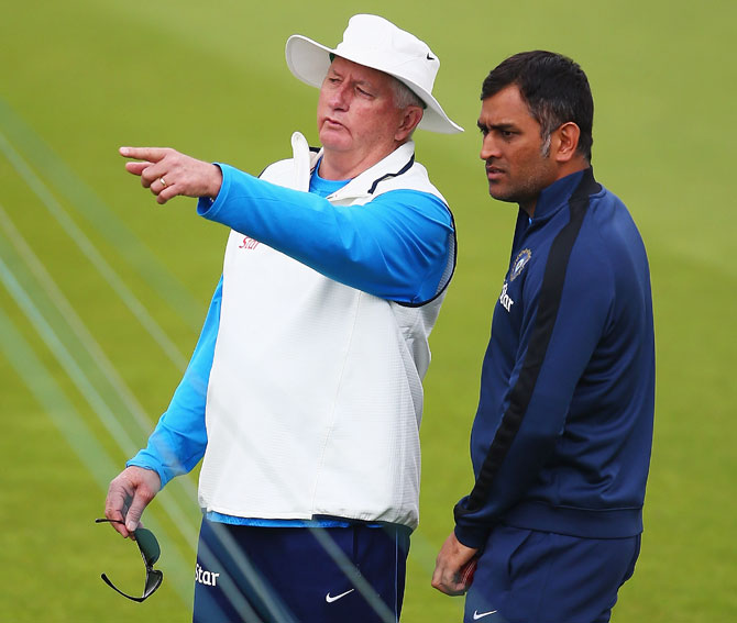 Duncan Fletcher, coach of India, talks to captain MS Dhoni during a India nets session
