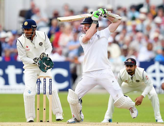 Wicketkeeper Mahendra Singh Dhoni and Virat Kohli, at slips, watch as Sam Robson cuts the ball for a boundary