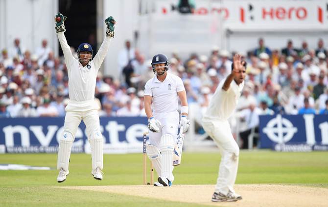 Mahendra Singh Dhoni and Bhuvneshwar Kumar appeal successfully for the wicket of Matt Prior