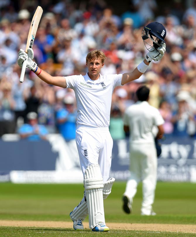 Joe Root celebrates after completing his century