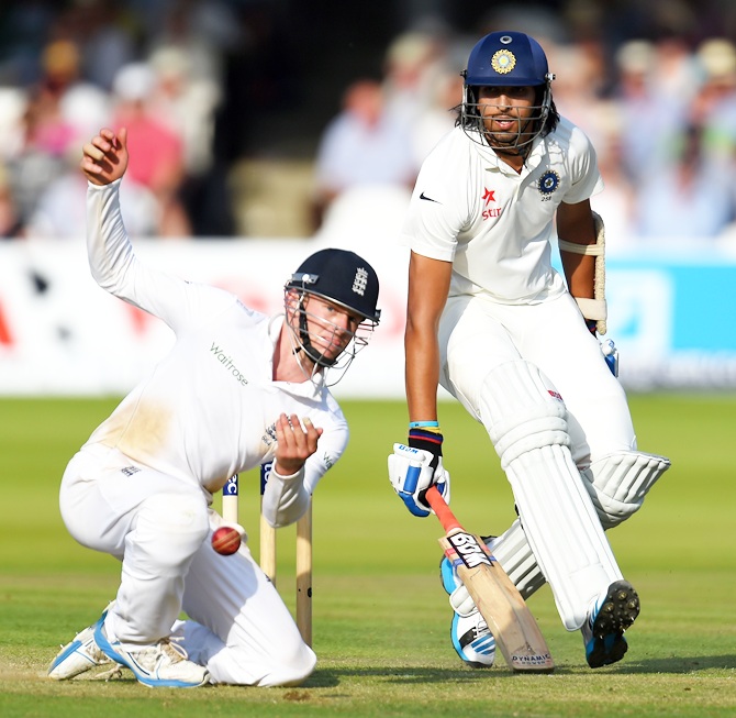 India batsman Ishant Sharma makes his ground despite the efforts of fielder Sam Robson