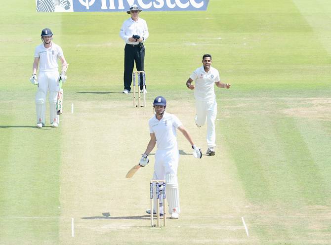 India pacer Bhuvneshwar Kumar celebrates after England captain Alastair Cook is caught by Mahendra Singh Dhoni (not in pic) on Day 2 of the second Test at Lord's