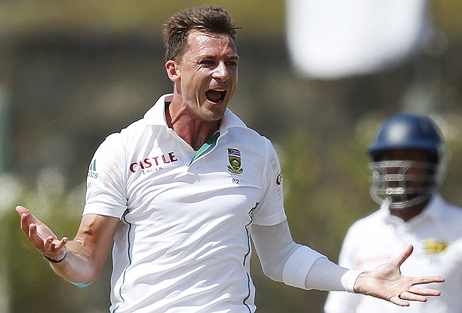 South Africa's Dale Steyn (left) celebrates after taking the wicket of Sri Lanka's Kaushal Silva during the fifth day of their first Test in Galle on Sunday