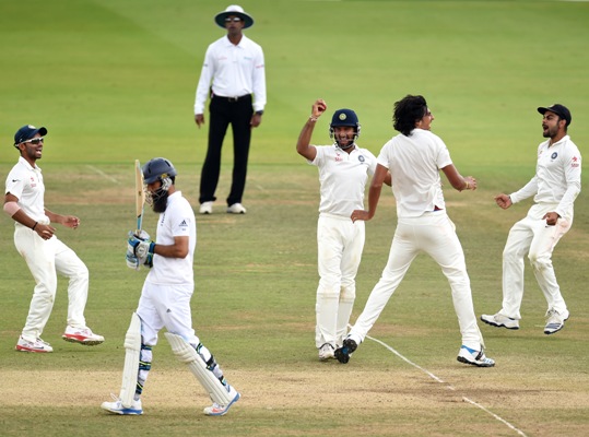England batsman Moeen Ali walks off after being caught by Cheteshwar Pujara (centre), off bowler Ishant Sharma (second right)