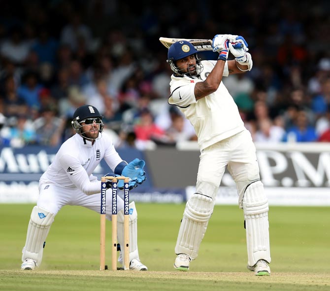 Murali Vijay hits out as England wicketkeeper Matt Prior (left) looks on