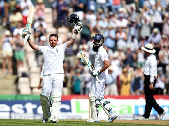 England batsman Ian Bell celebrates his century as Moeen Ali applauds during day two of the 3rd Investec Test at Ageas Bowl