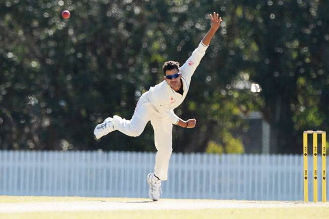 Manoj Tiwary of India 'A' bowls during the Quadrangular series match against Australia 'A' at the Allan Border Field on July 8, 2014 in Brisbane, Australia