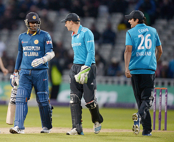 Jos Buttler of England and Angelo Mathews of Sri Lanka exchange words during the  One Day International match on Tuesday