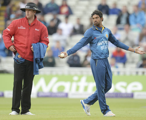 Sri Lanka's Sachithra Senanayake appeals for the run-out of England's Jos Buttler (not in picture) as umpire Michael Gough (left) looks on during the fifth One-Day International at Edgbaston.
