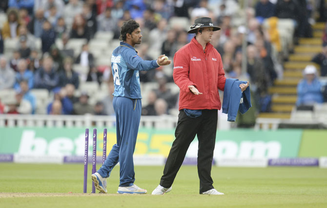 Sri Lanka's Sachithra Senanayake appeals for the run-out of England non-striker Jos Buttler (not in picture) to umpire Michael Gough (right)
