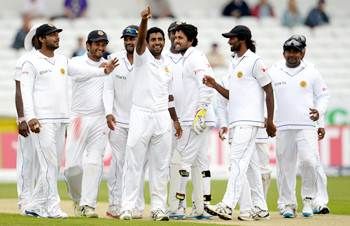 Sri Lanka's Dhammika Prasad (centre) celebrates with team-mates after the dismissal of England's Matt Prior