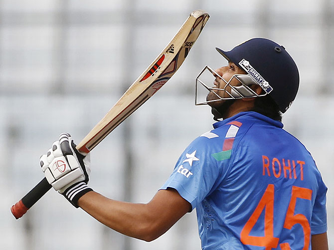 India's Rohit Sharma celebrates after scoring a half century against Pakistan on Sunday