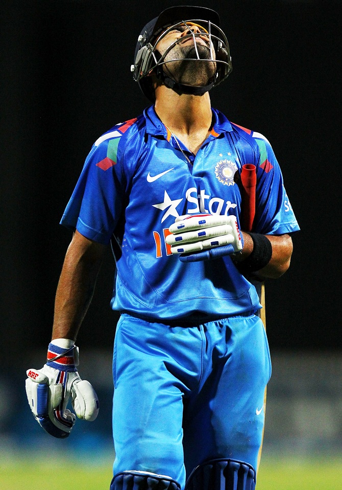 Virat Kohli of India reacts as he leaves the field.
