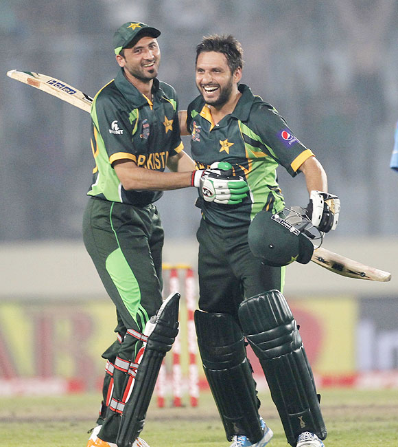 Pakistan's Shahid Afridi and Junaid Khan (left) celebrate after Pakistan won their Asia Cup ODI against India in Dhaka on Sunday
