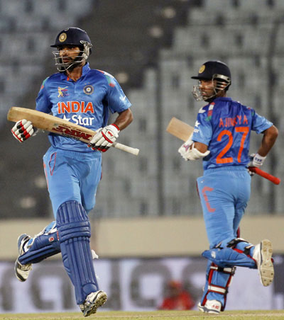 India's Shikhar Dhawan (left) and Ajinkya Rahane run between the wickets against Afghanistan in their Asia Cup match in Dhaka