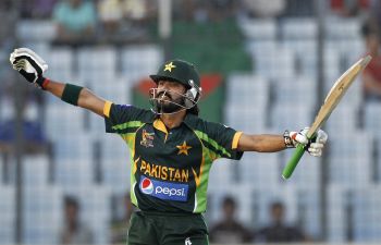 Fawad Alam celebrates after completing his century