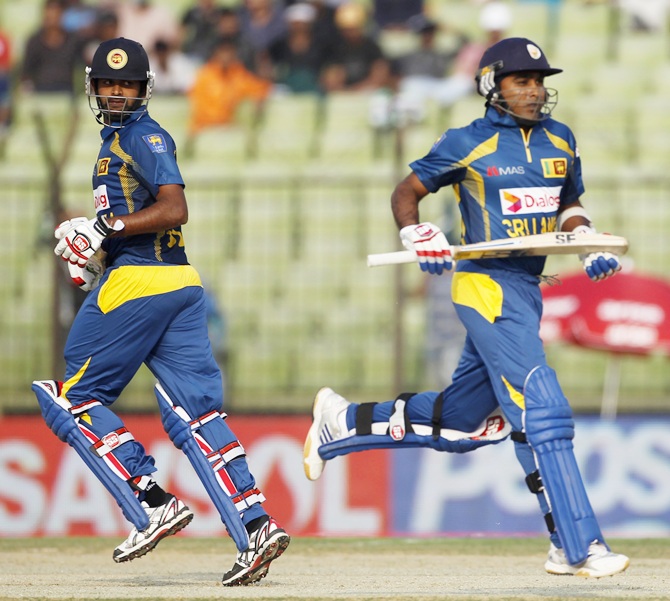 Sri Lanka's Lahiru Thirimanne and Mahela Jayawardene, right, run between the wickets against Pakistan.